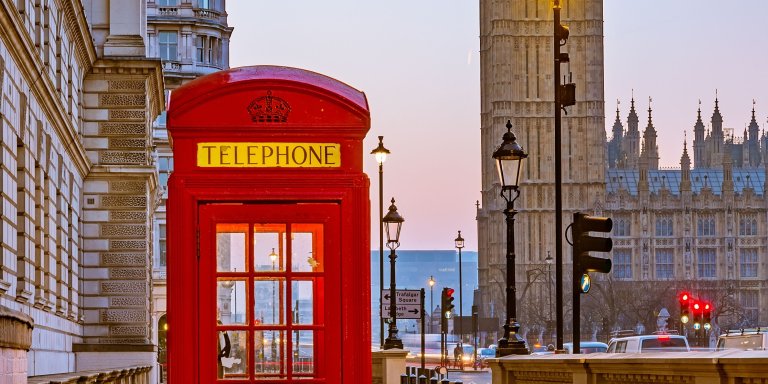 traditional red phone booth in London. Photo canva.com