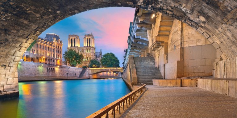 view pf riverside of the Seine river in Paris at sunset.